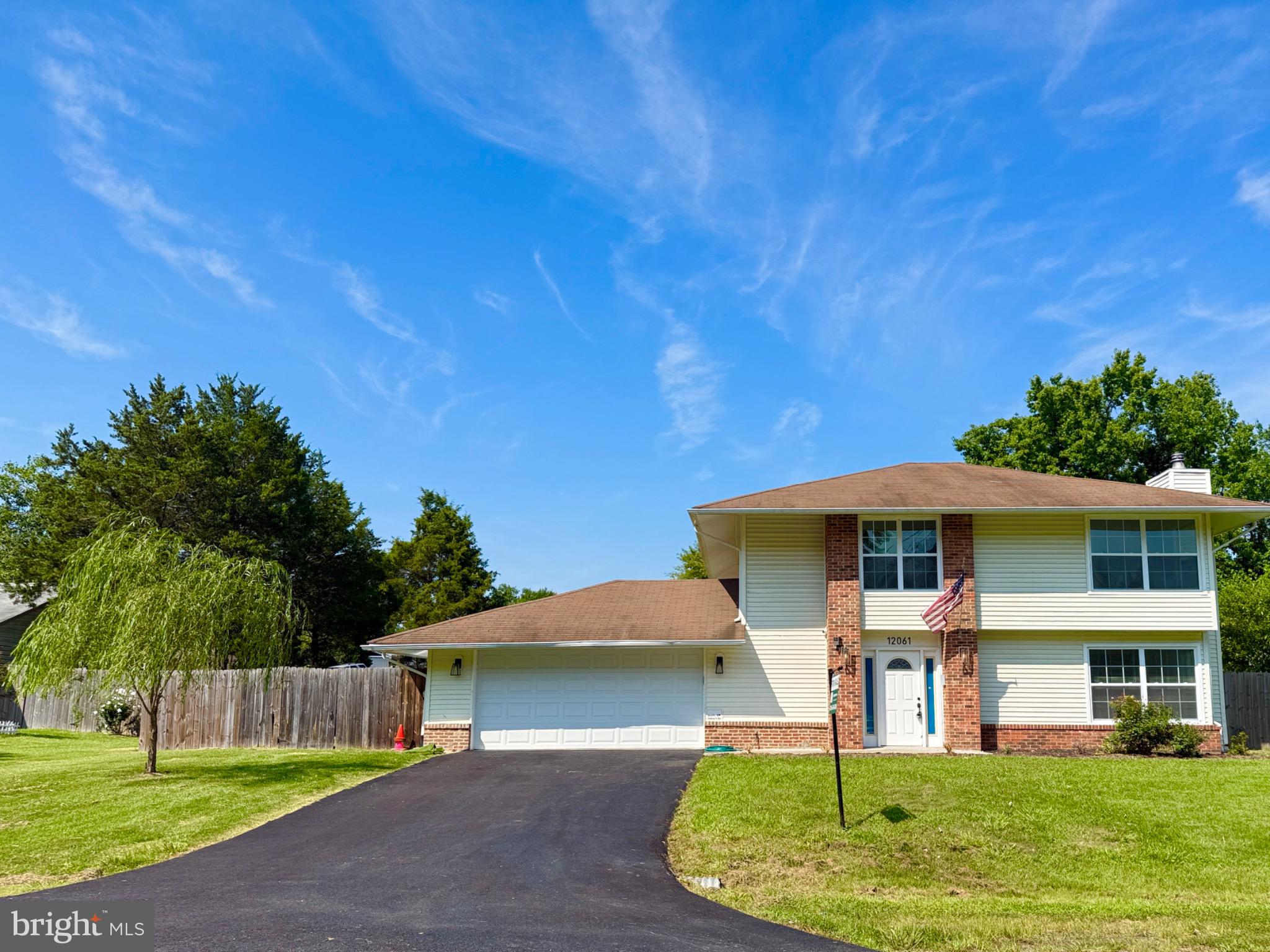 Charming home under a bright blue sky.