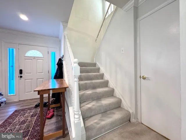 a view of entryway with wooden floor