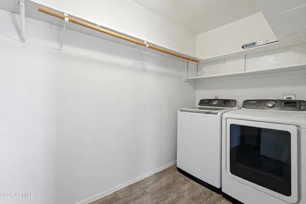 a patio with table and chairs