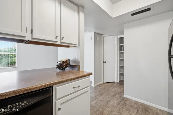 an empty room with windows and closet