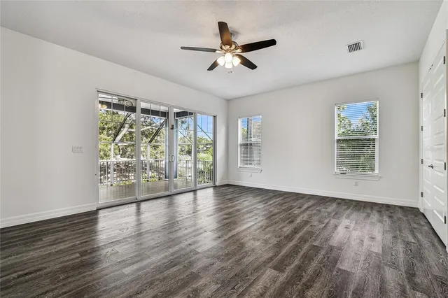 a bathroom with a granite countertop toilet sink and shower
