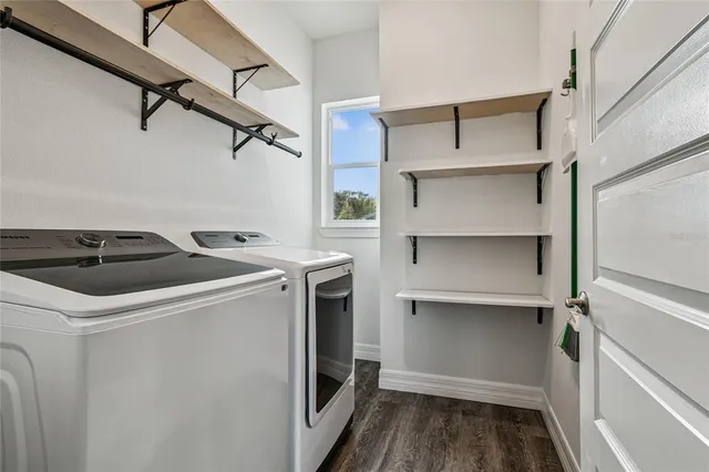 a bathroom with a granite countertop sink toilet and a mirror