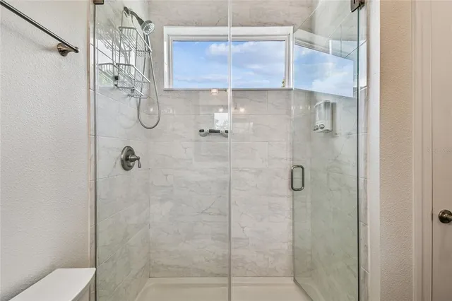 a view of porch with a floor to ceiling window and an outdoor view