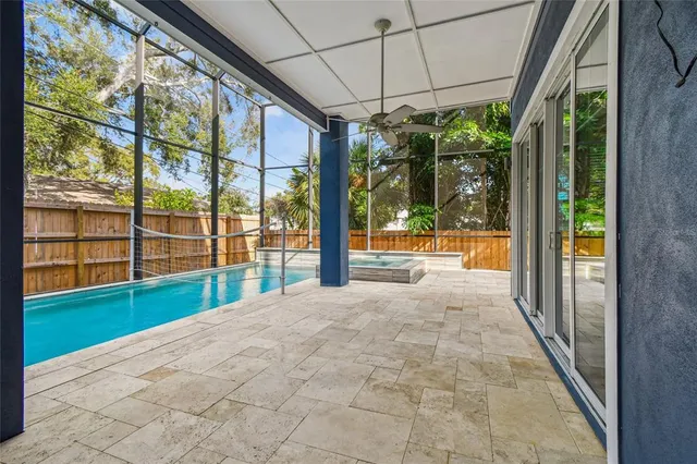 an empty room with wooden floor and white doors