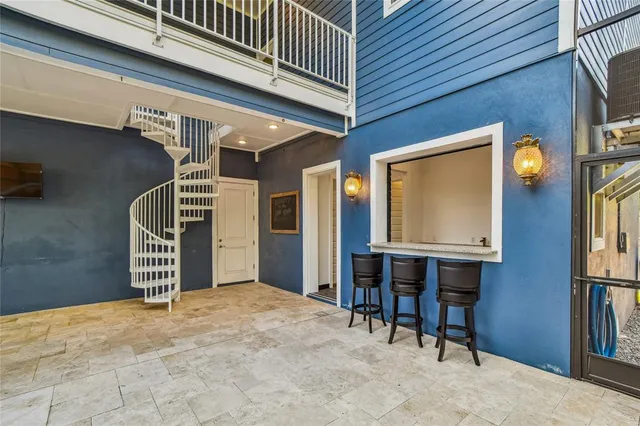 a front view of a house with a garden and yard