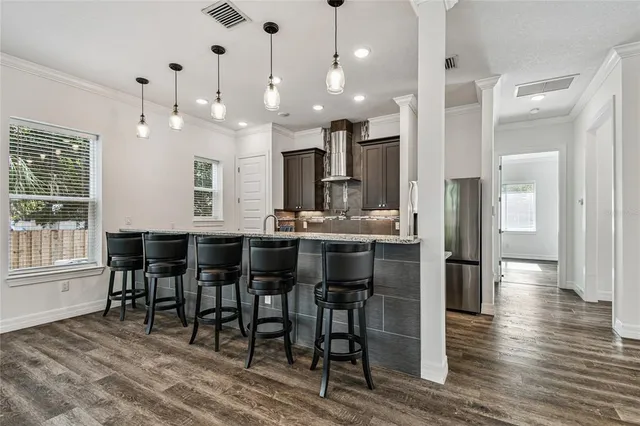 a kitchen with a sink and a large window