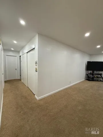 a bed room with a bed mirror and a table