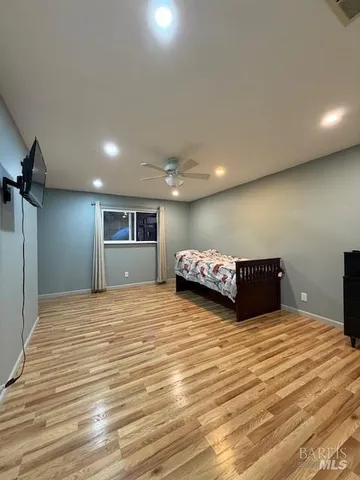 a bedroom with a bed and a view of bathroom