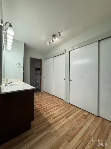 a bathroom with a glass shower door