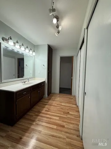 a white toilet sitting next to a bathroom sink