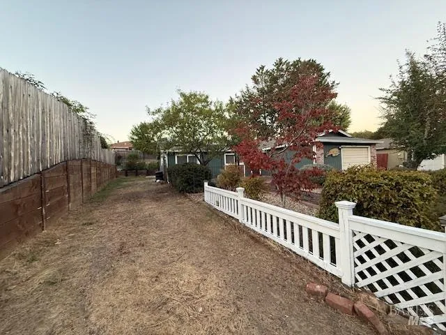 a view of a backyard with sitting area