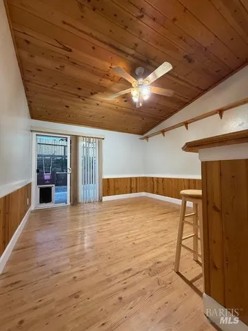 a view of a chairs and table in a wooden floor