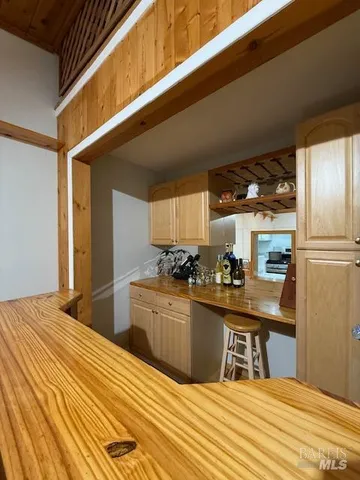 a kitchen with granite countertop appliances cabinets and a sink