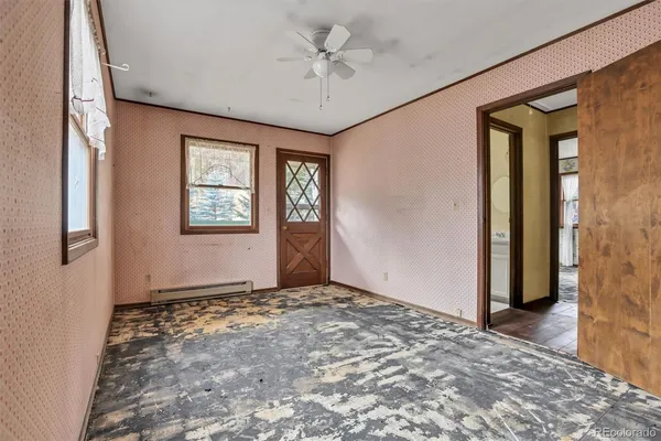 a view of an empty room with a window