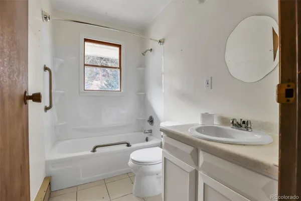 a bathroom with a sink a toilet and a bathtub