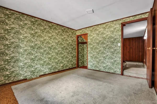 a view of an empty room with a window