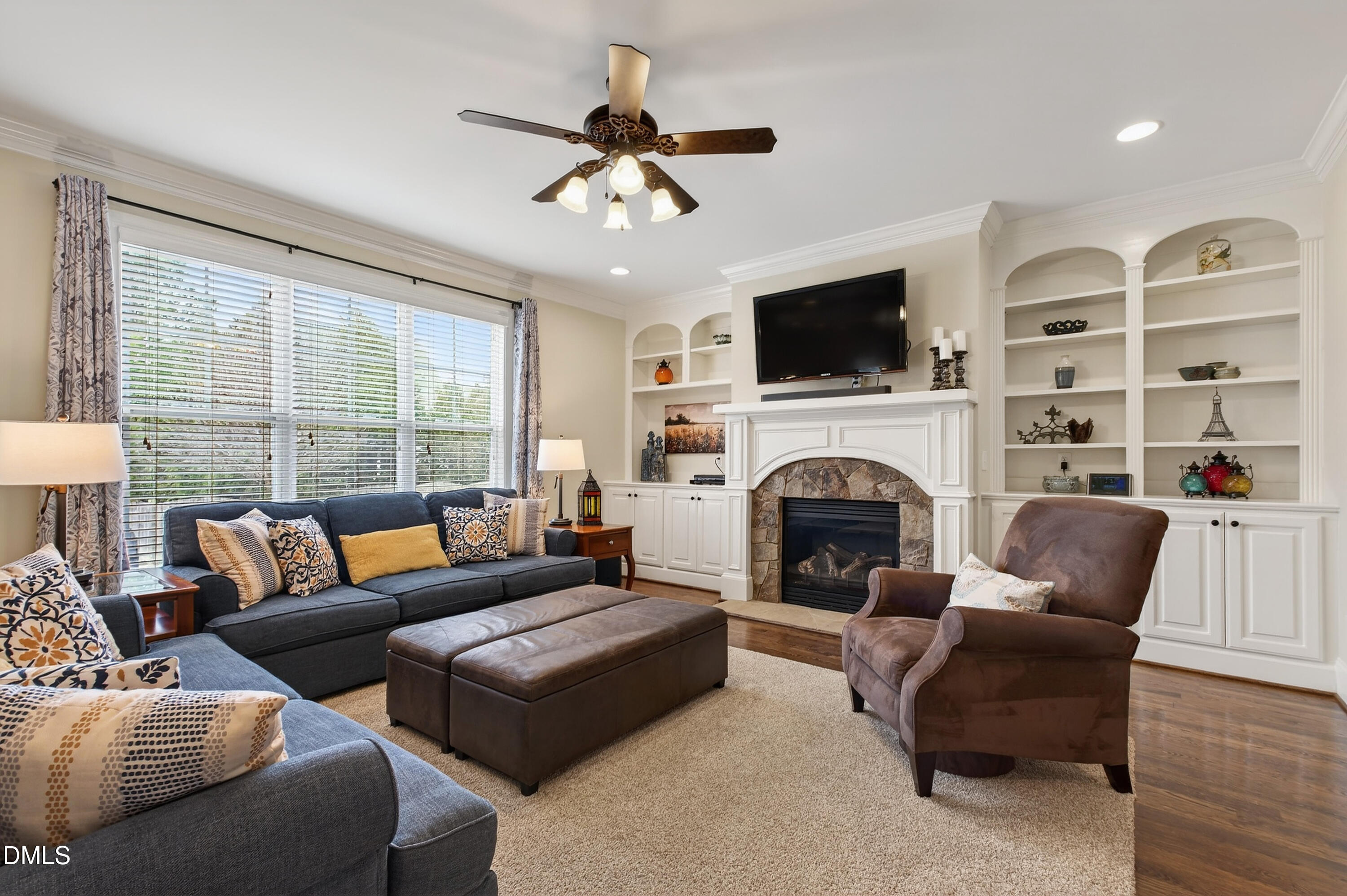 417 Wanderview Lane Holly Springs, NC 27540 - Photo 16 of 86 a living room with furniture fireplace and flat screen tv
