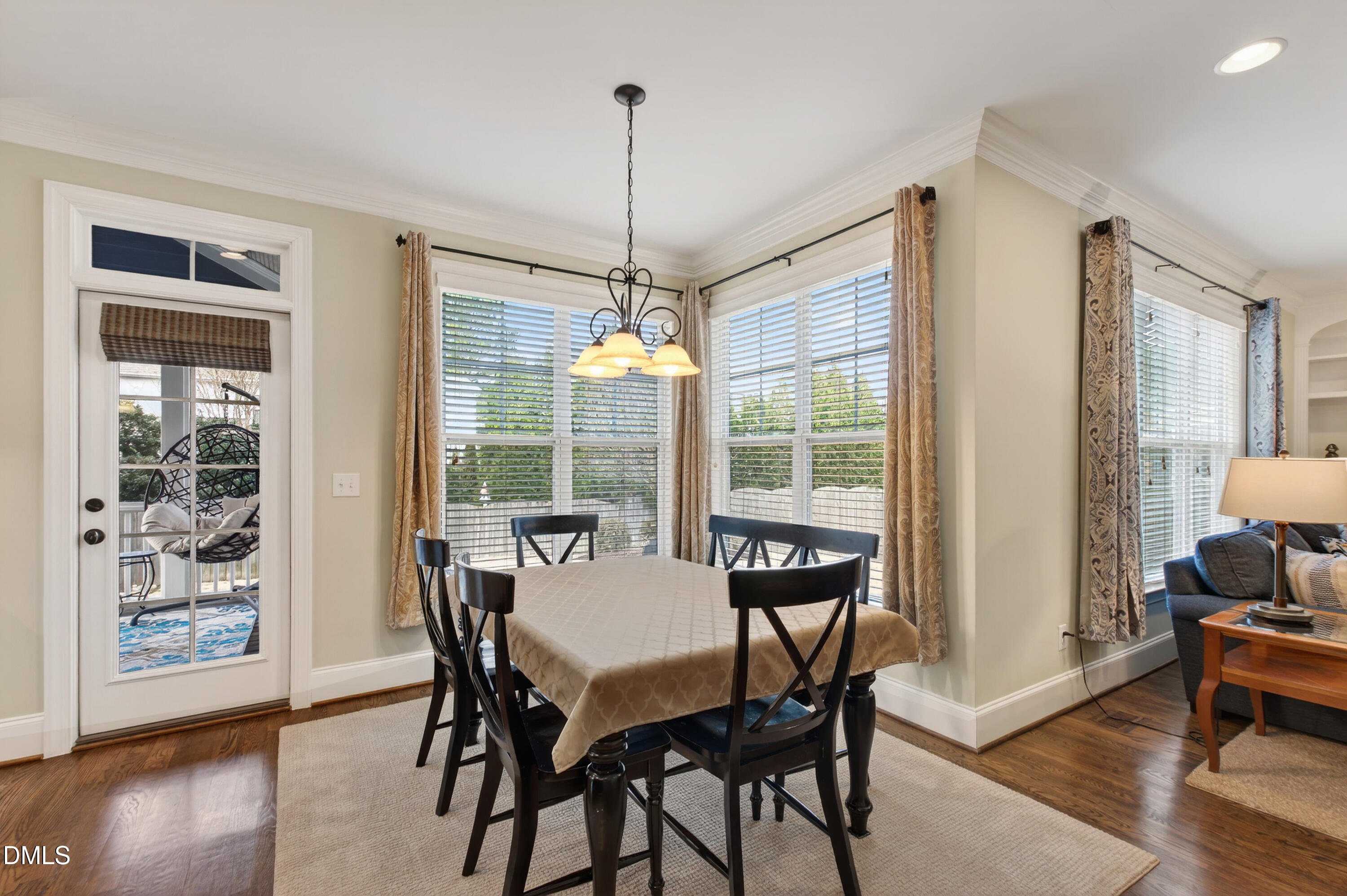 417 Wanderview Lane Holly Springs, NC 27540 - Photo 21 of 86 a dining room with furniture window wooden floor