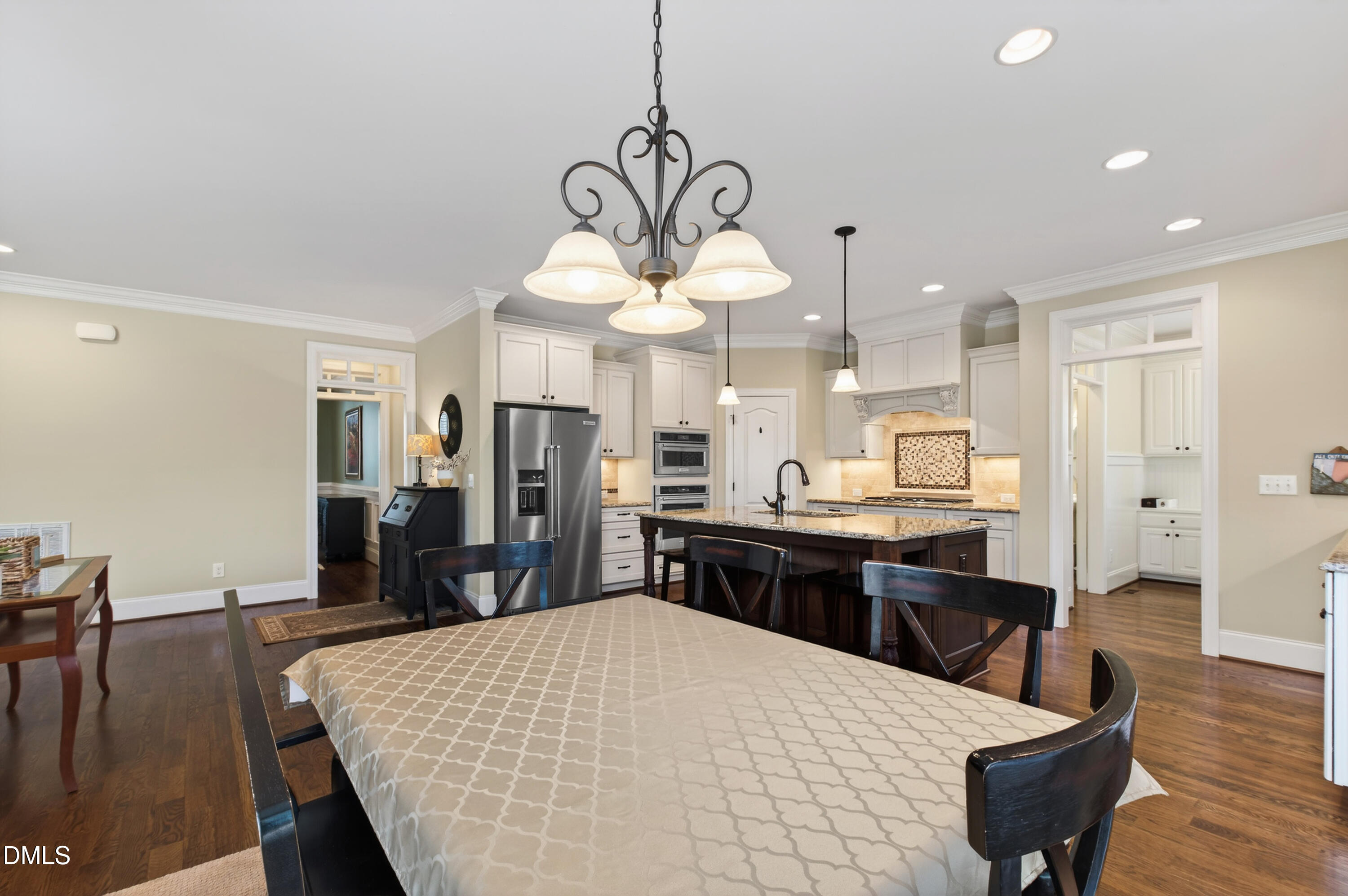 417 Wanderview Lane Holly Springs, NC 27540 - Photo 22 of 86 a kitchen with a table and chairs in it
