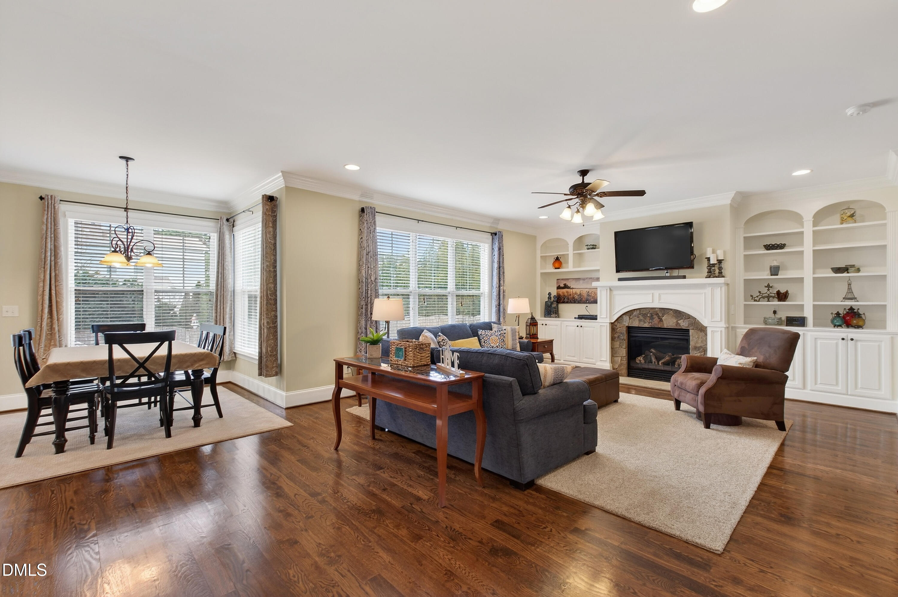 417 Wanderview Lane Holly Springs, NC 27540 - Photo 2 of 86 a living room with furniture fireplace and flat screen tv