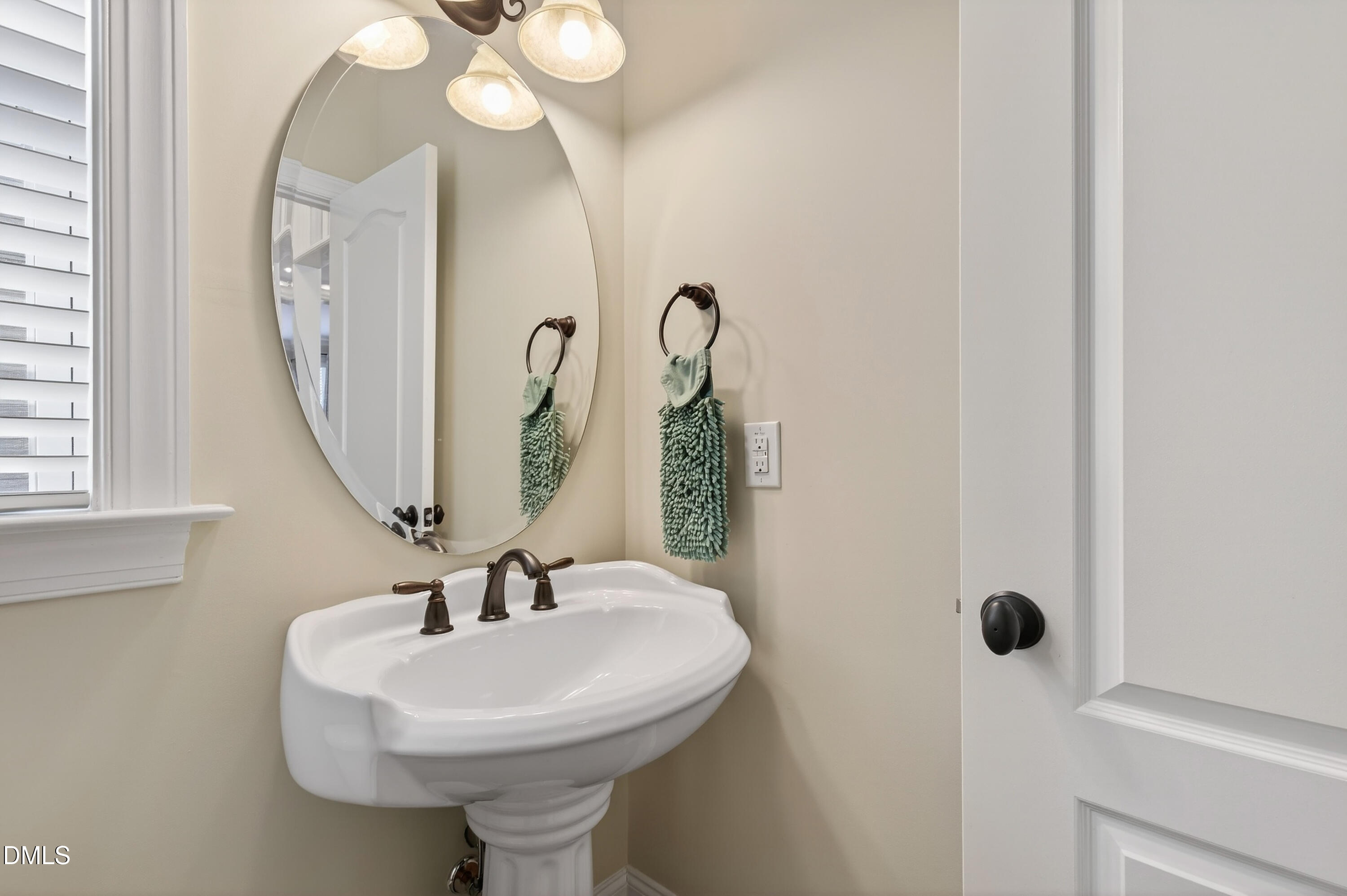 417 Wanderview Lane Holly Springs, NC 27540 - Photo 29 of 86 a bathroom with a sink a toilet and a mirror