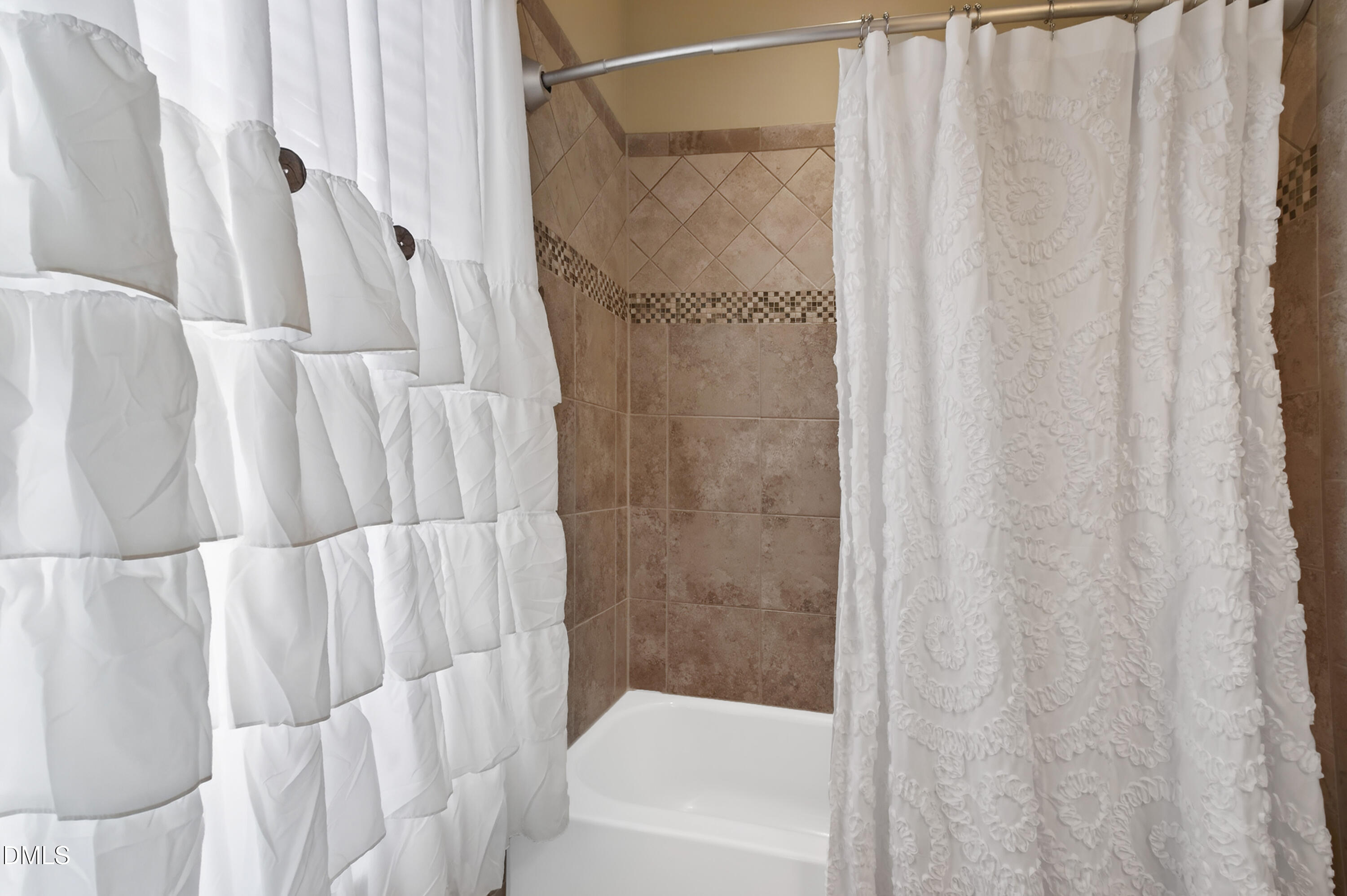 417 Wanderview Lane Holly Springs, NC 27540 - Photo 39 of 86 a bathroom with a shower and a tub