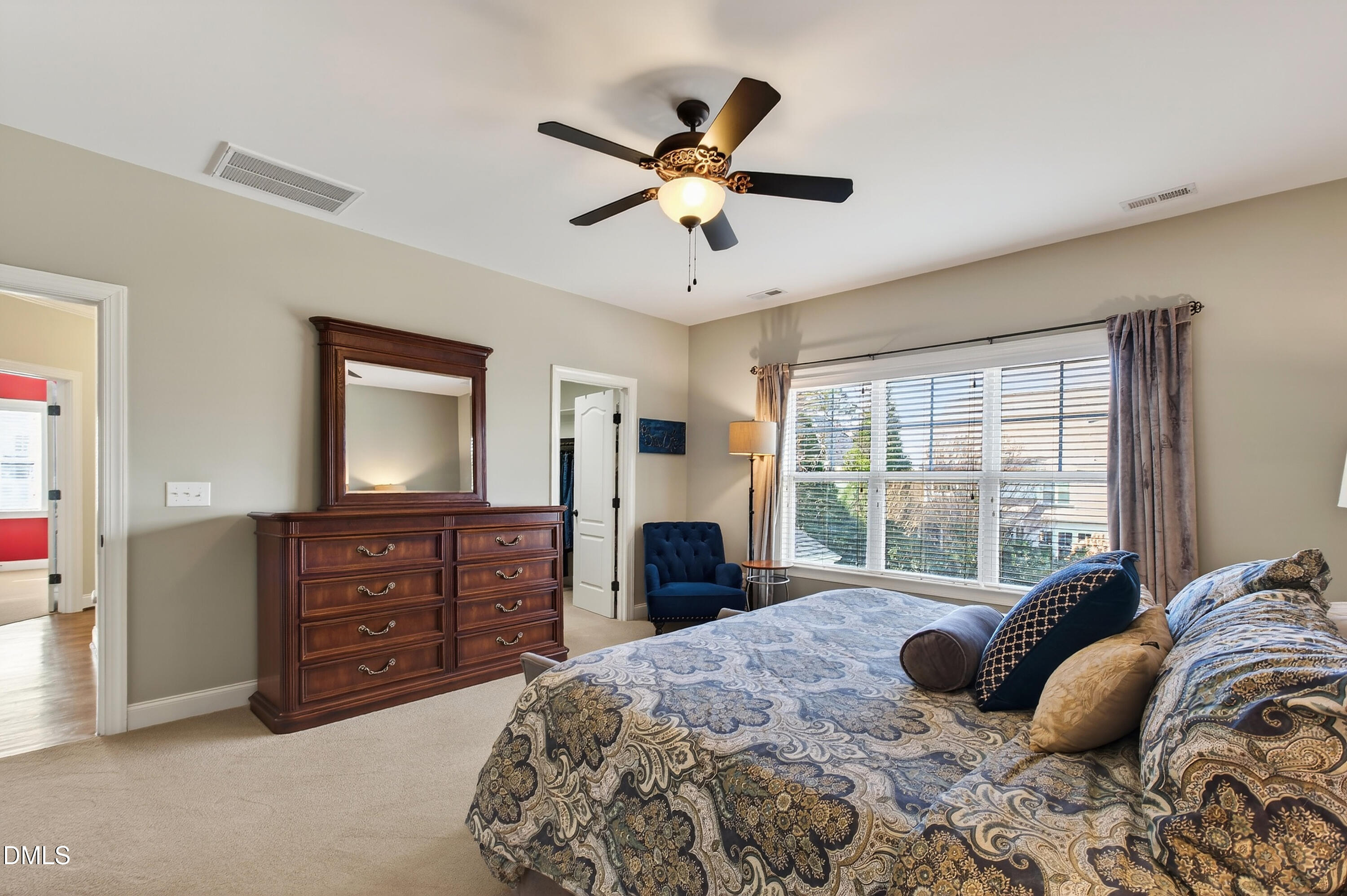 417 Wanderview Lane Holly Springs, NC 27540 - Photo 40 of 86 a bedroom with a bed and a dresser