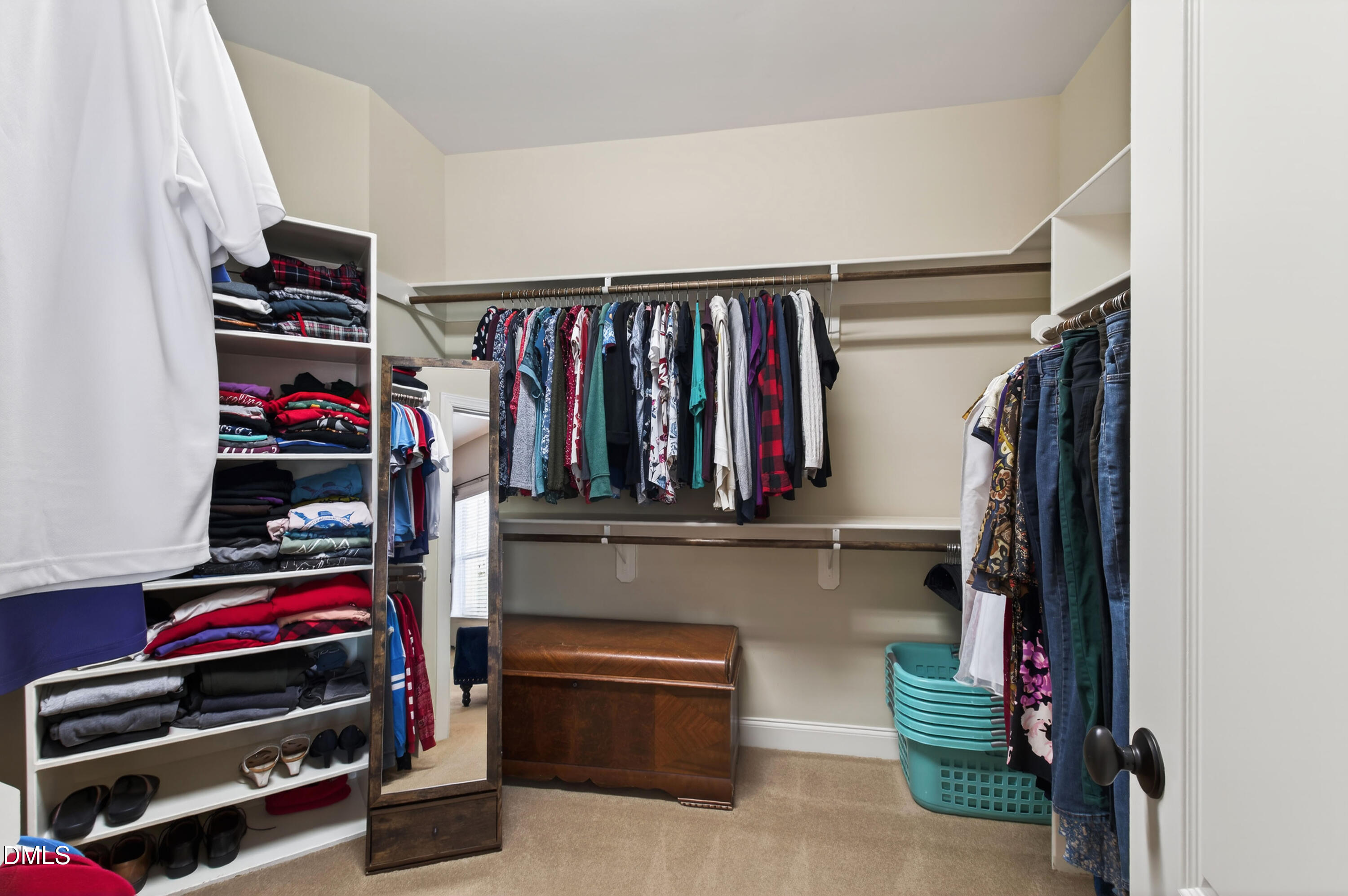 417 Wanderview Lane Holly Springs, NC 27540 - Photo 42 of 86 a view of walk in closet with clothes and shoes