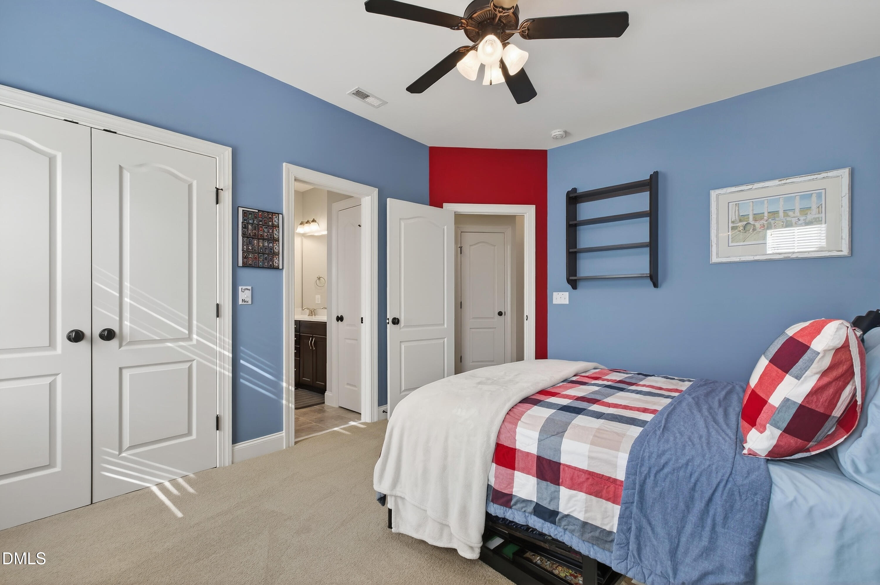 417 Wanderview Lane Holly Springs, NC 27540 - Photo 47 of 86 a bedroom with a bed and a chandelier