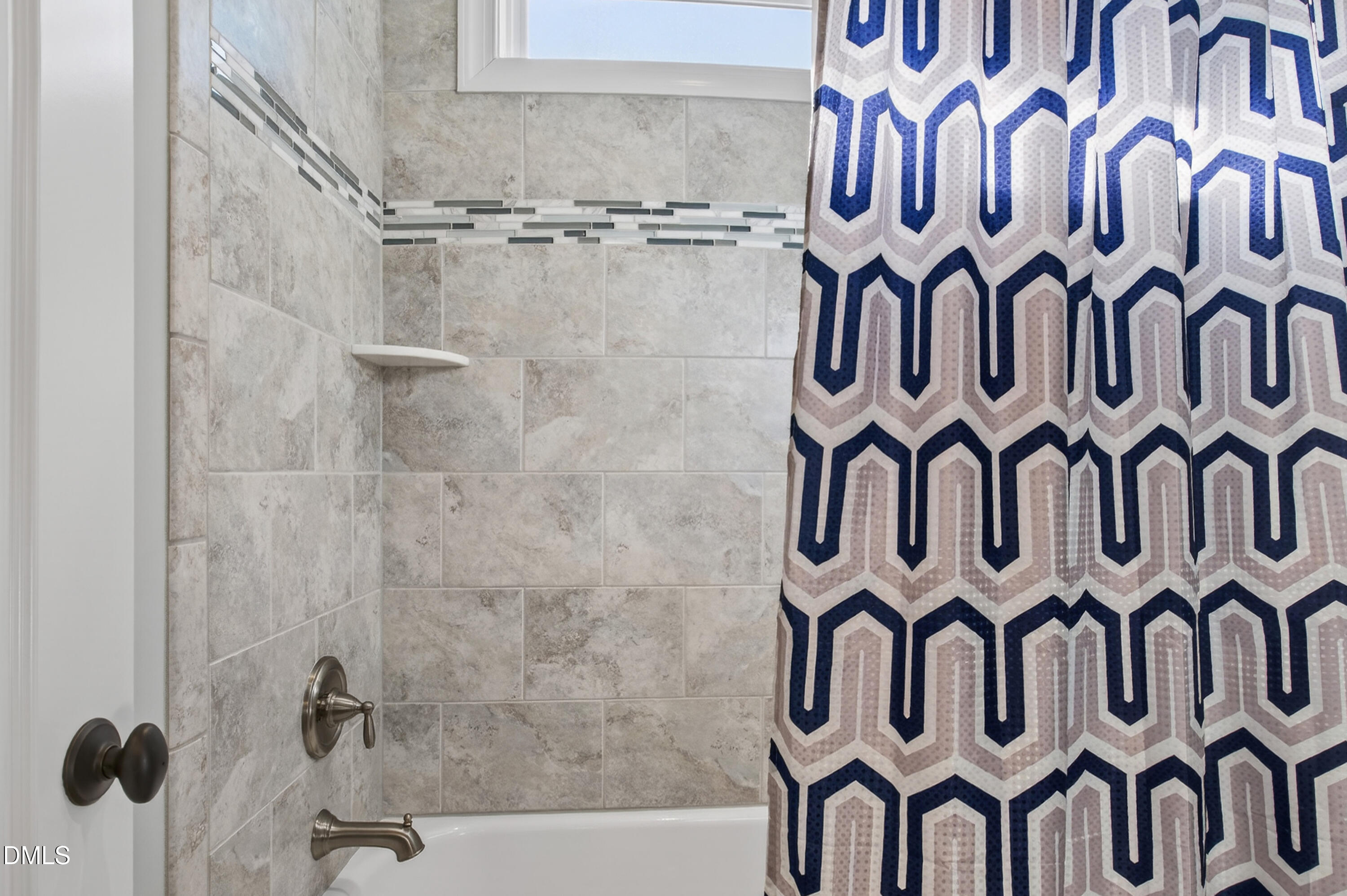 417 Wanderview Lane Holly Springs, NC 27540 - Photo 49 of 86 a bathroom with a bathtub and shower curtain