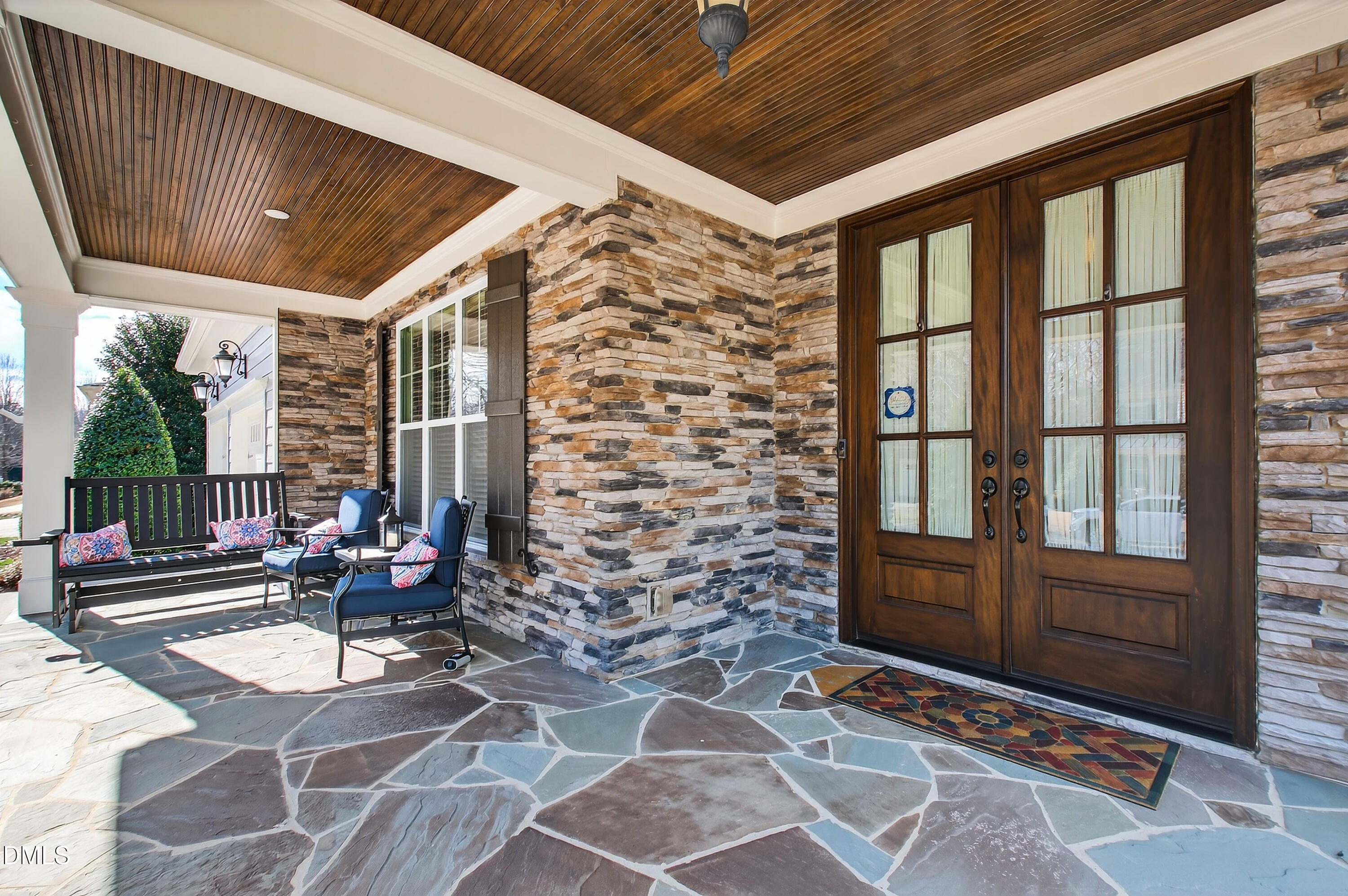 417 Wanderview Lane Holly Springs, NC 27540 - Photo 57 of 86 a building outdoor space with patio furniture and potted plants
