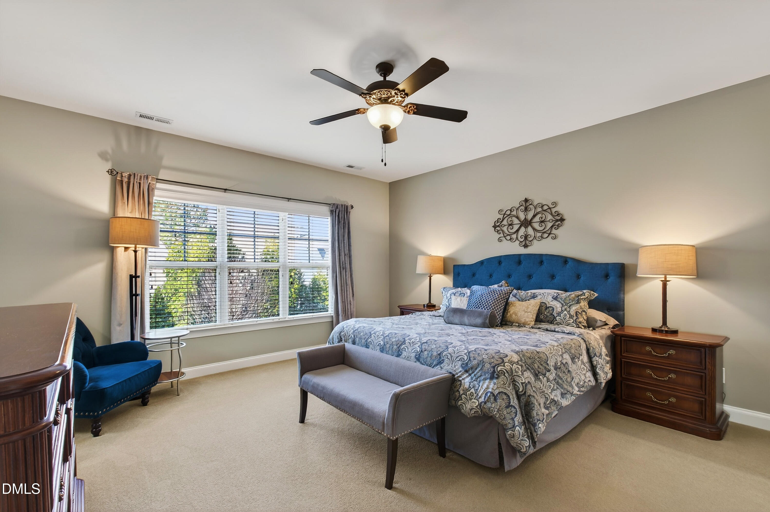 417 Wanderview Lane Holly Springs, NC 27540 - Photo 5 of 86 a spacious bedroom with a bed and a couch