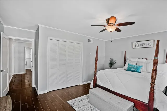 a bedroom with furniture and a flat tv screen
