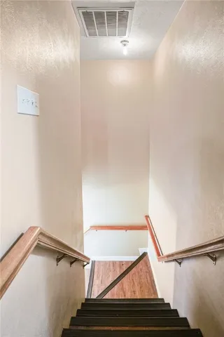 a view of a house with swimming pool and sitting area