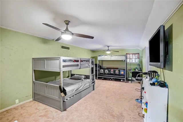 a living room with furniture a rug and a table