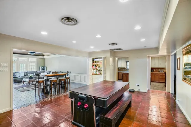 a kitchen with a table and chairs