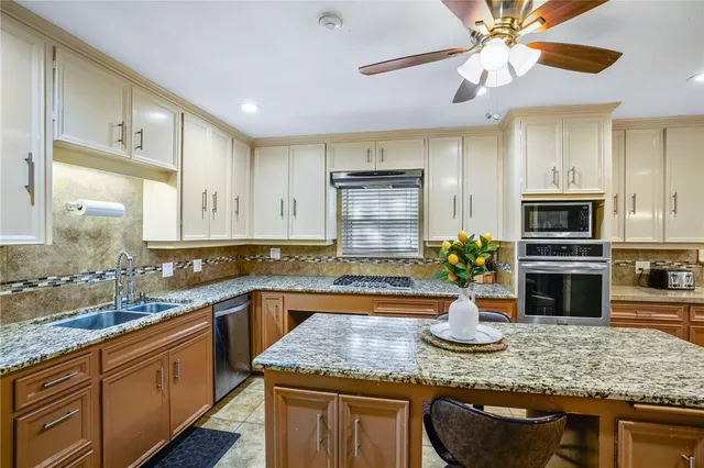 a view of a hallway with a dining room and stairs