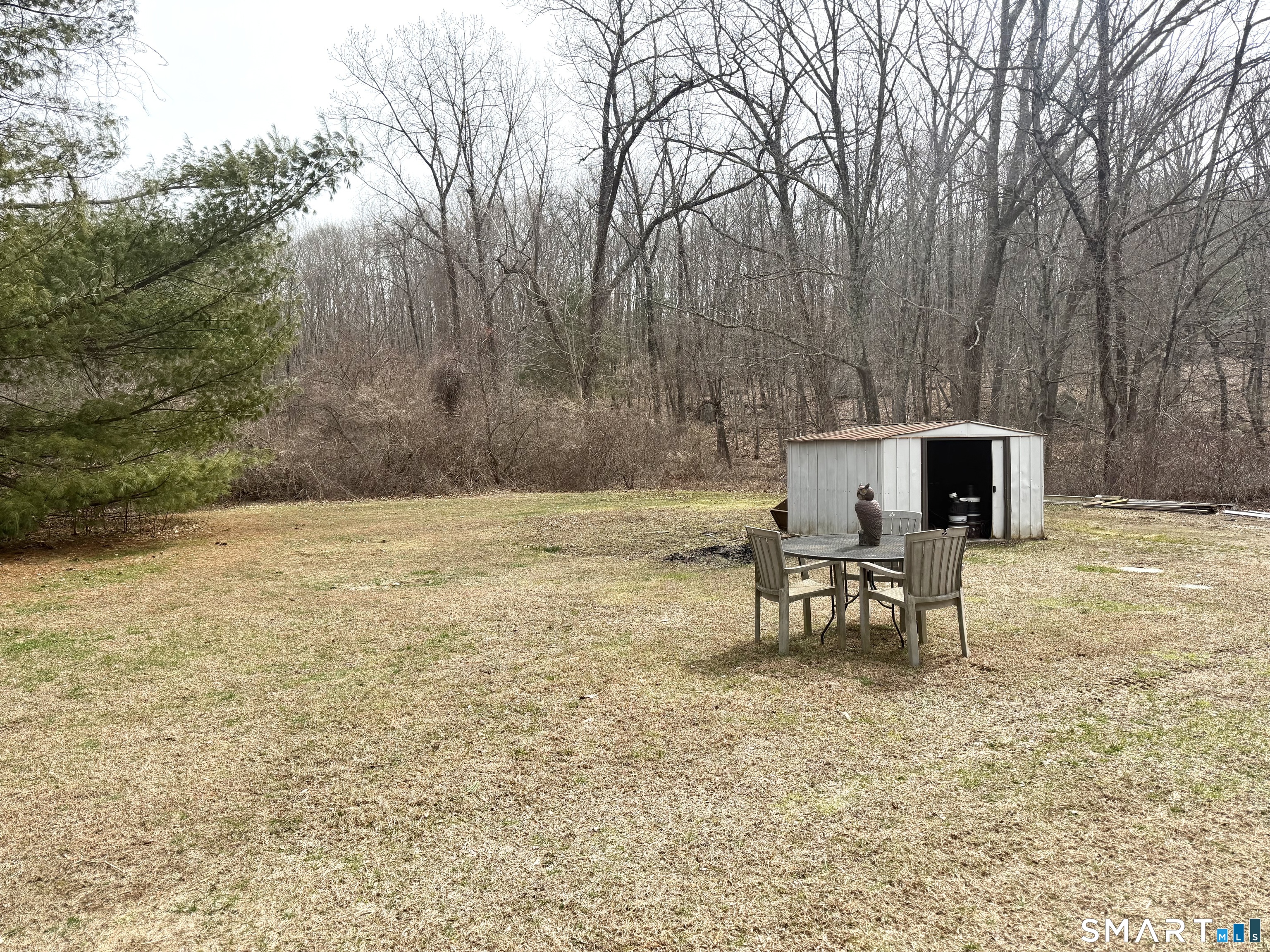 360 Garder Road Monroe, CT 06468 - Photo 12 of 15 a view of a yard with a bench and some trees