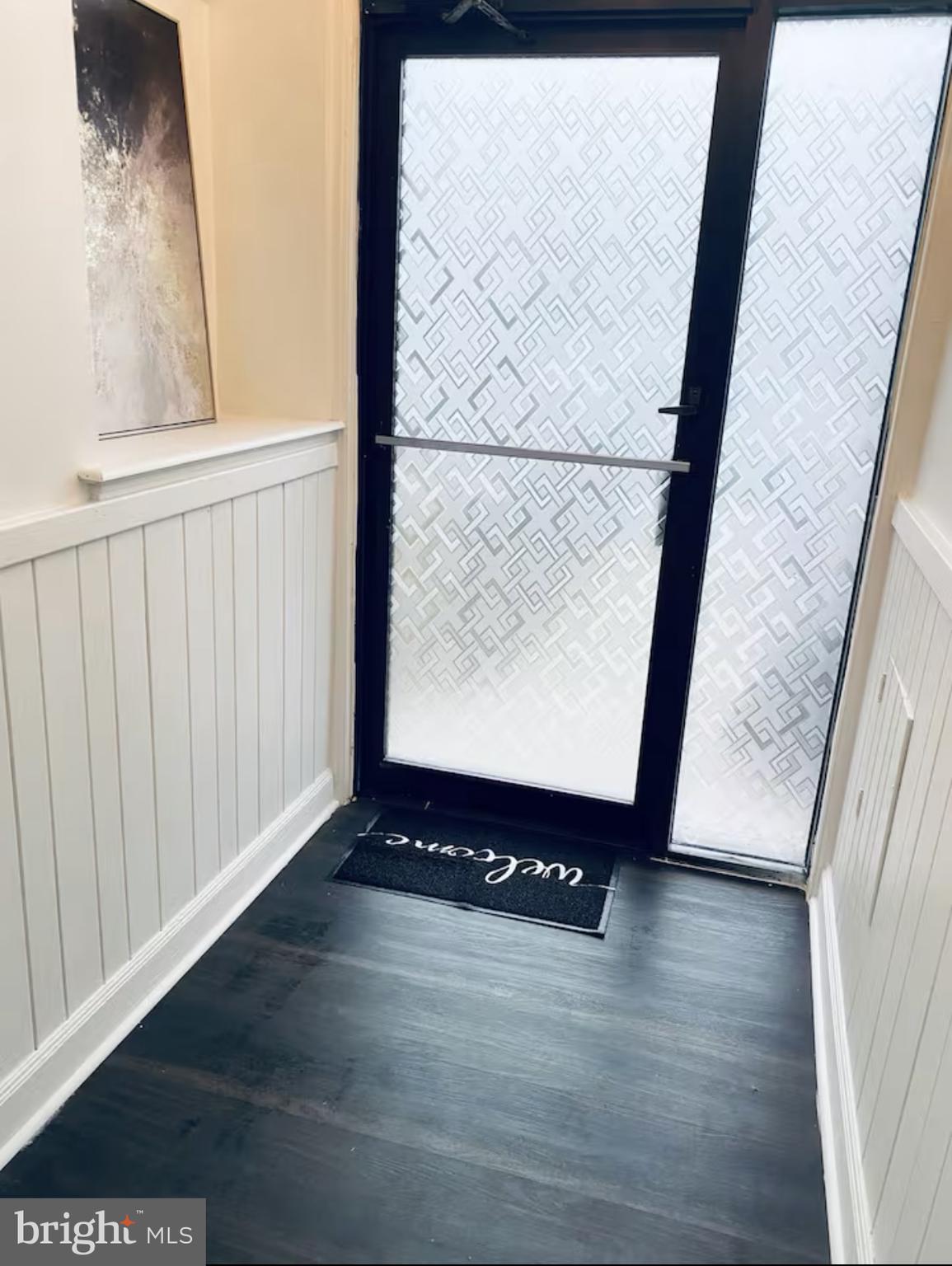 1268 Raum Street Northeast Washington, DC 20002 - Photo 11 of 46 a view of an empty room with wooden floor and a window