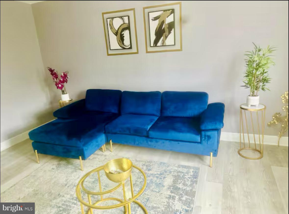 1268 Raum Street Northeast Washington, DC 20002 - Photo 12 of 46 a living room with furniture and a potted plant
