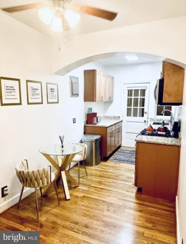 a bathroom with a toilet and a mirror