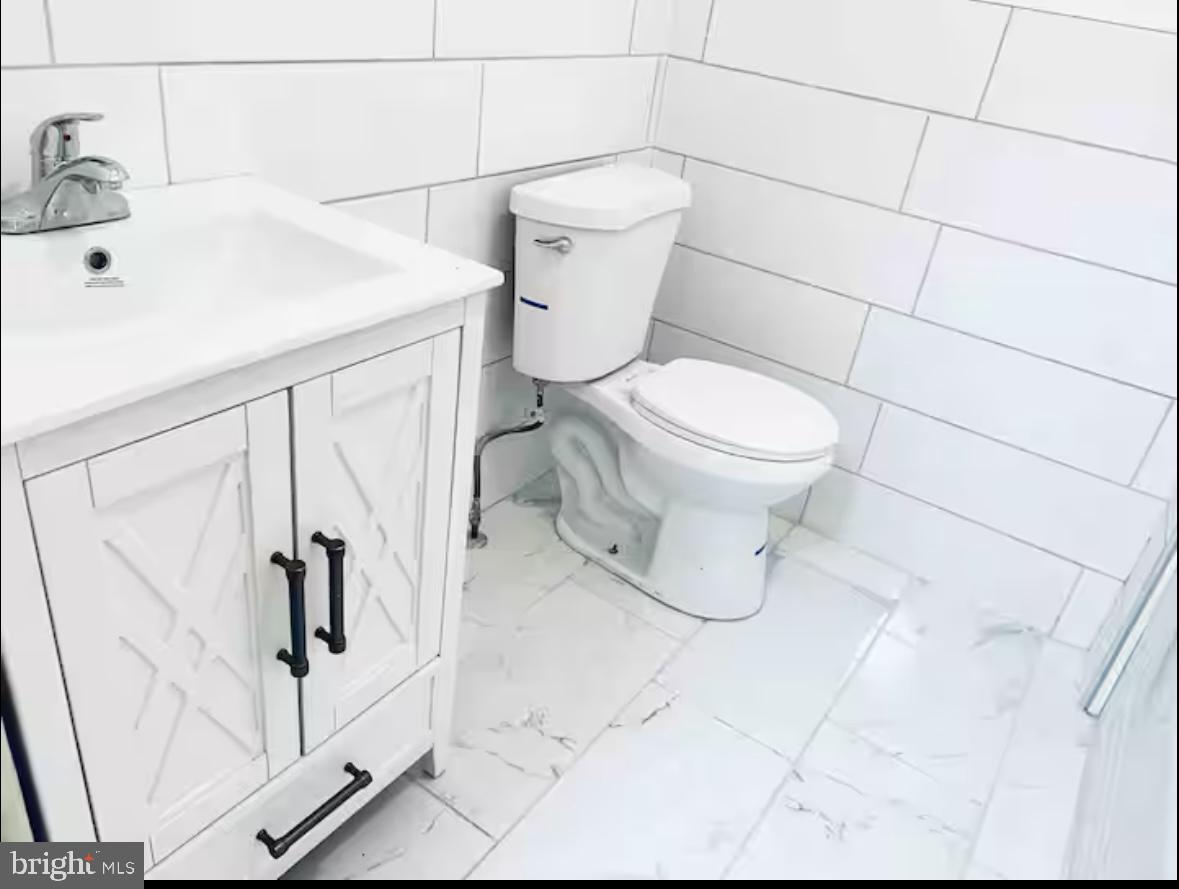 1268 Raum Street Northeast Washington, DC 20002 - Photo 17 of 46 a bathroom with a toilet and a shower