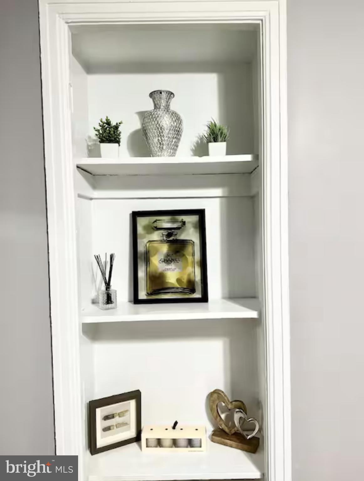 1268 Raum Street Northeast Washington, DC 20002 - Photo 2 of 46 a close view of a fireplace with painting on it