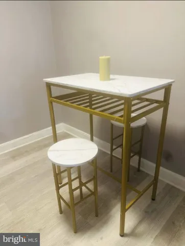 a view of a living room and a rug
