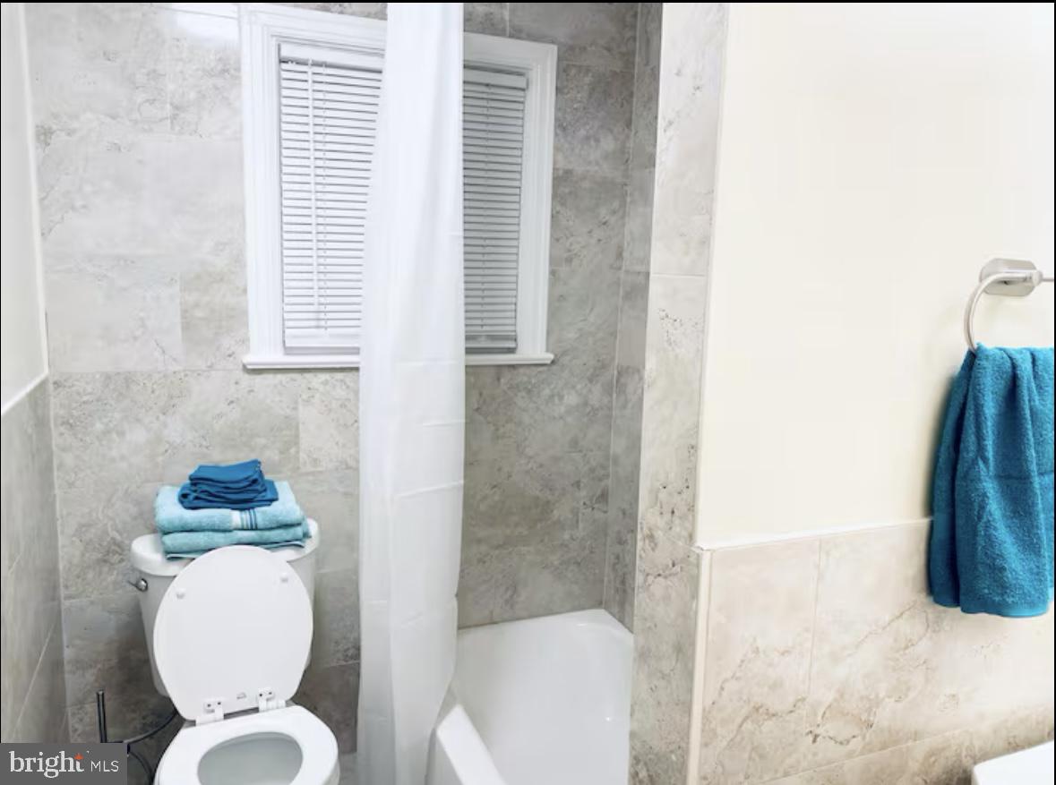 1268 Raum Street Northeast Washington, DC 20002 - Photo 22 of 46 a bathroom with a toilet sink and tub