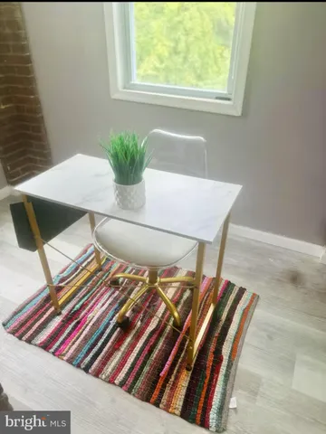 a view of dinning table and chairs