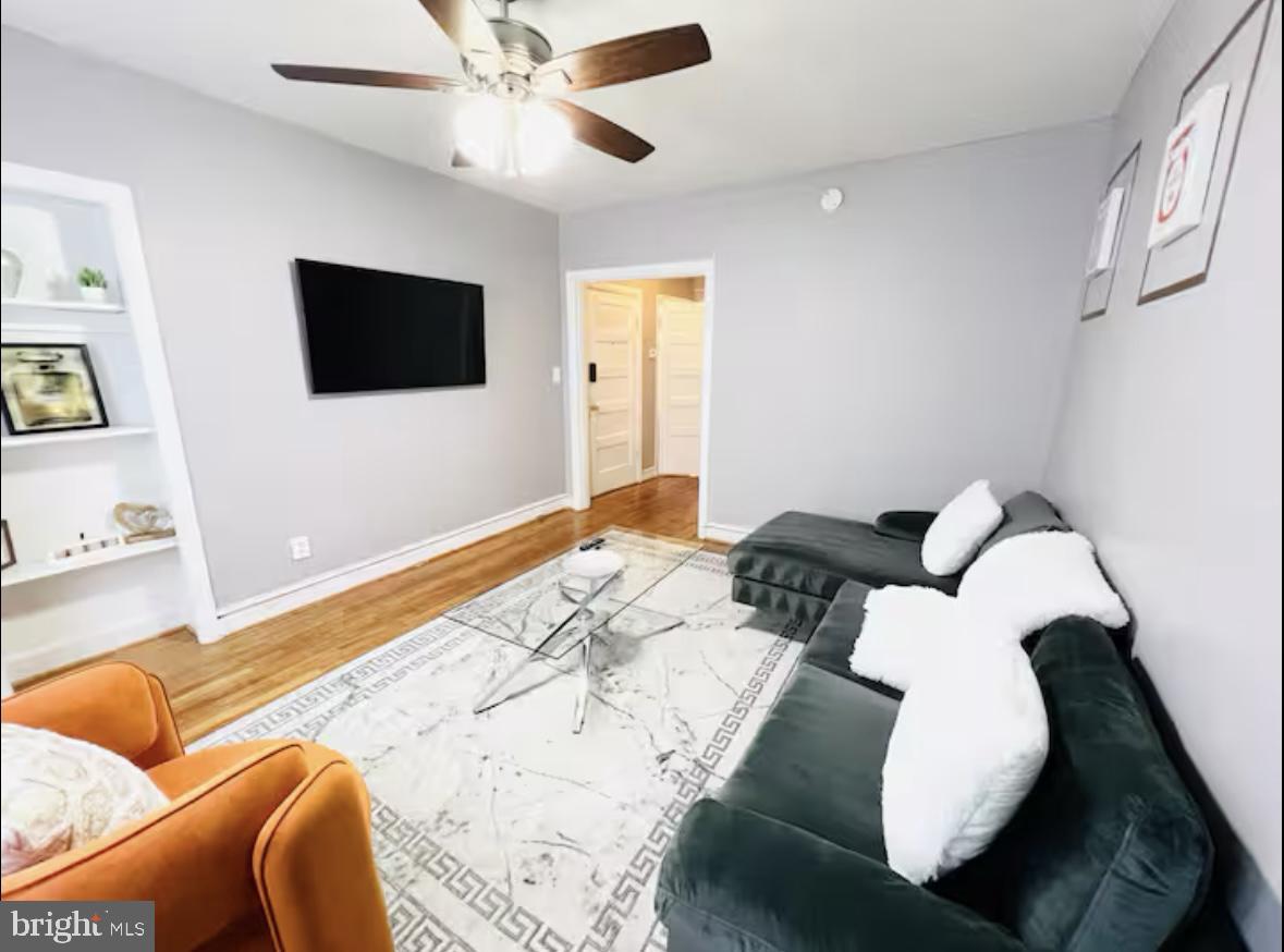 1268 Raum Street Northeast Washington, DC 20002 - Photo 24 of 46 a bedroom with a bed and a flat screen tv