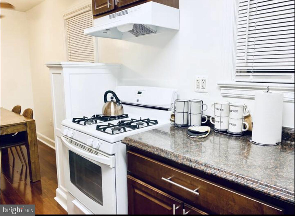 1268 Raum Street Northeast Washington, DC 20002 - Photo 26 of 46 a white stove top oven sitting inside of a kitchen