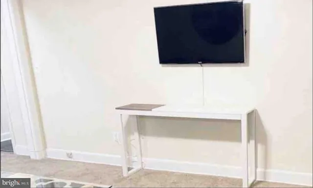 front view of a brick house with a large windows