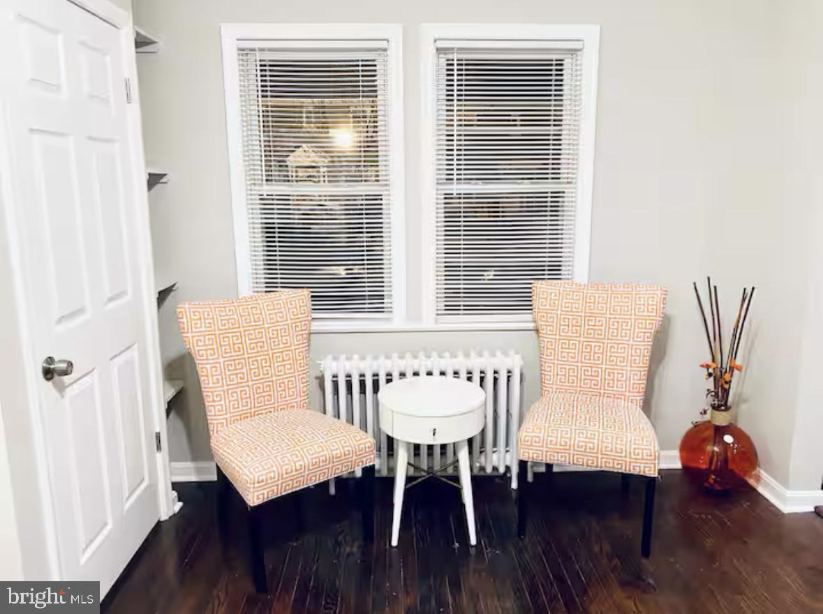 1268 Raum Street Northeast Washington, DC 20002 - Photo 28 of 46 a view of a room with furniture wooden floor and a window
